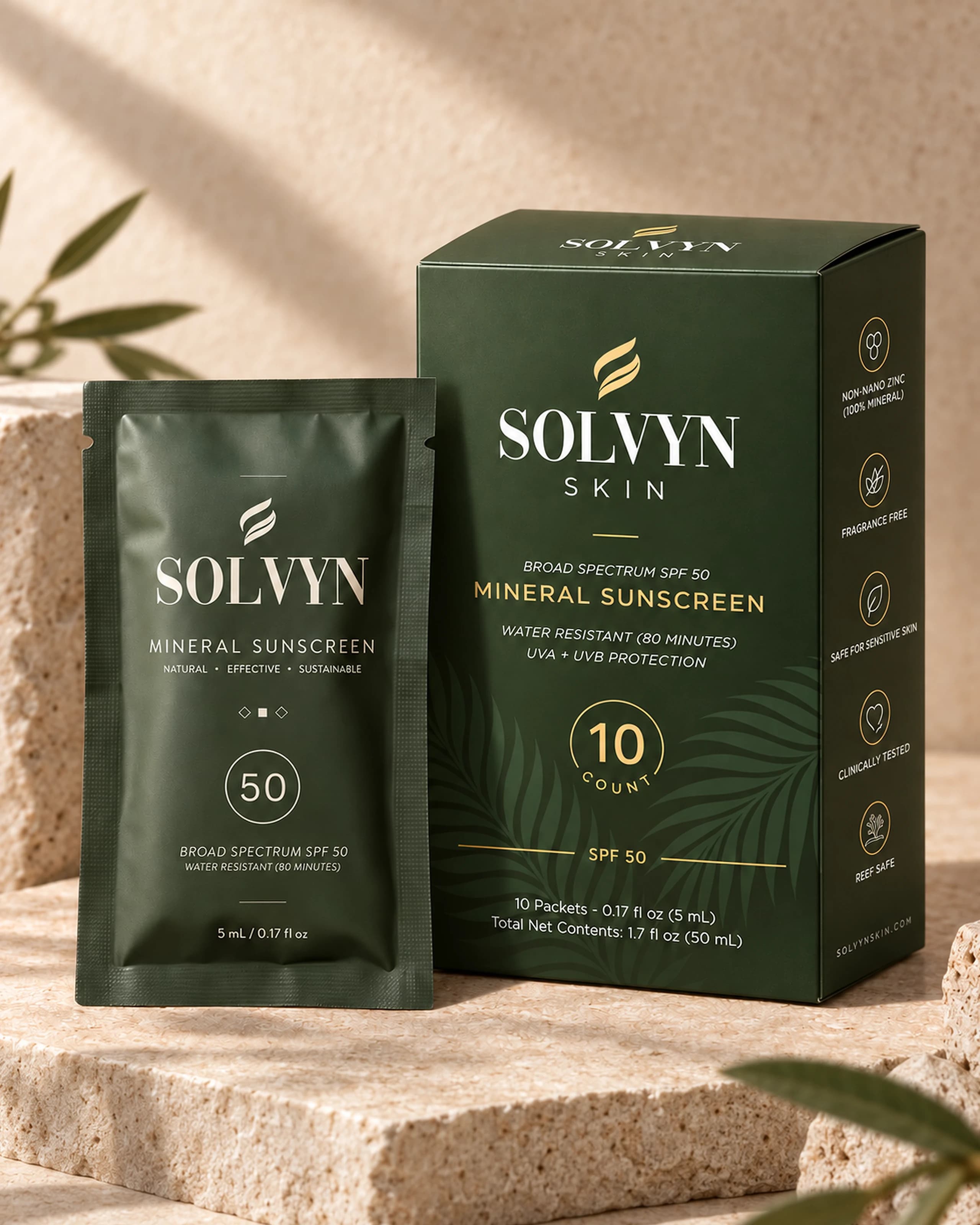 A ten-count carton of Solvyn Shield standing on sunlit travertine with one sealed single-use sachet propped in front of it, the two shown at true relative size